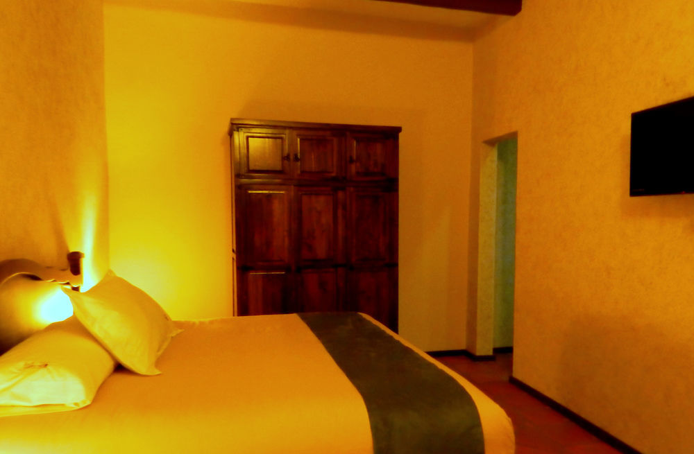 Collection O Al Otro Lado Del Rio, Puebla Hotel Kültér fotó A room at the hotel