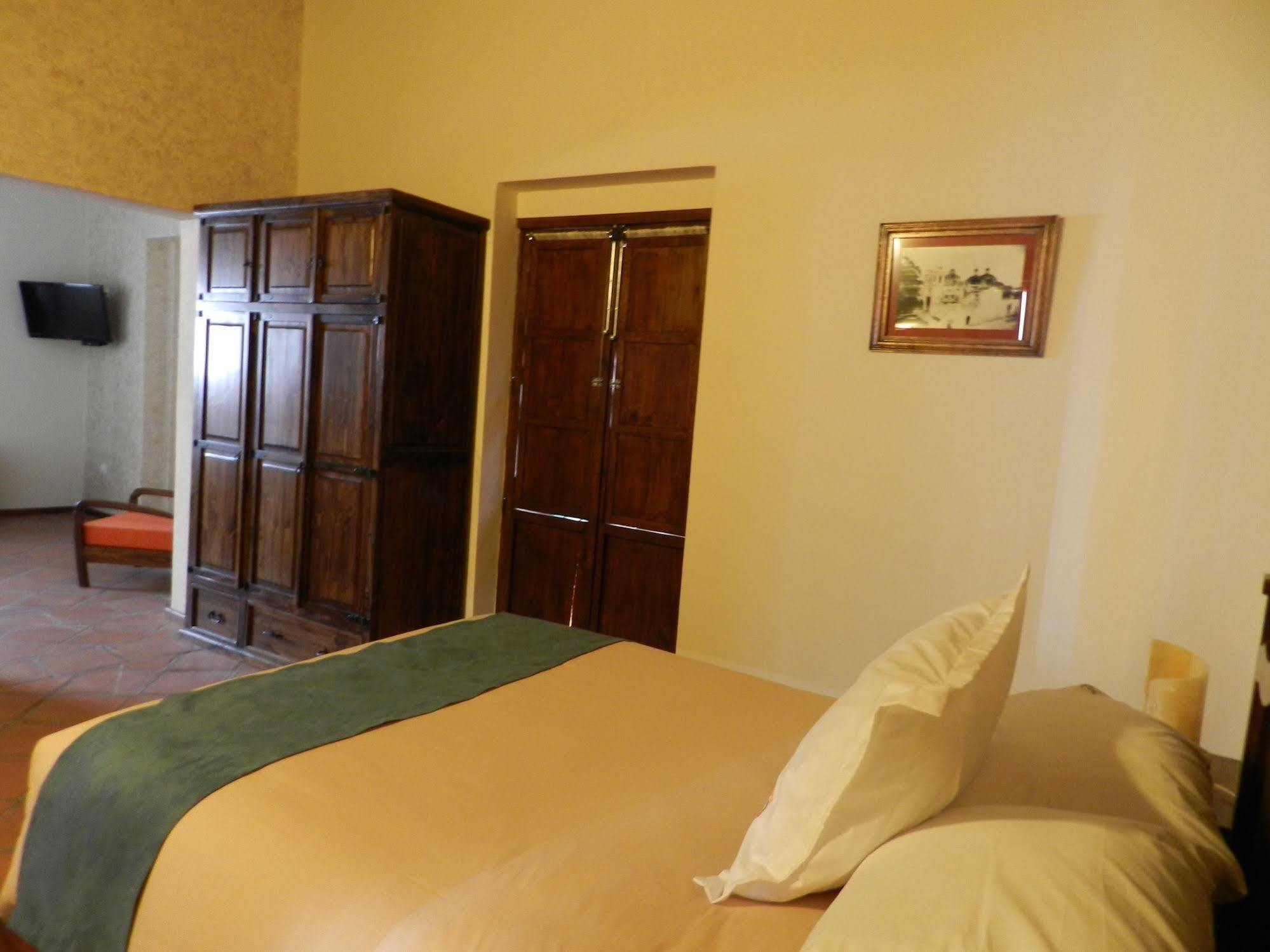 Collection O Al Otro Lado Del Rio, Puebla Hotel Kültér fotó A room at the hotel
