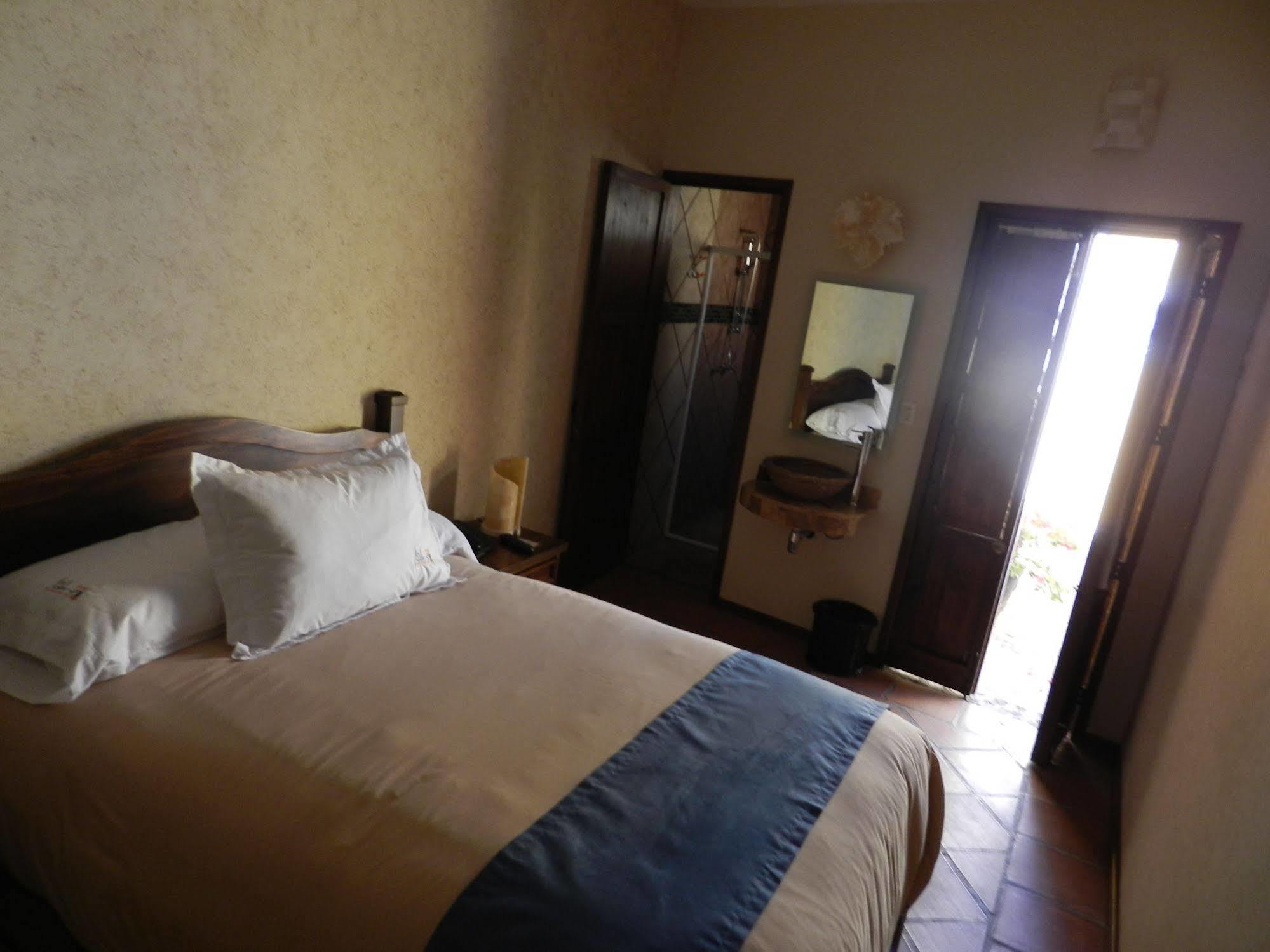 Collection O Al Otro Lado Del Rio, Puebla Hotel Kültér fotó A room at the hotel
