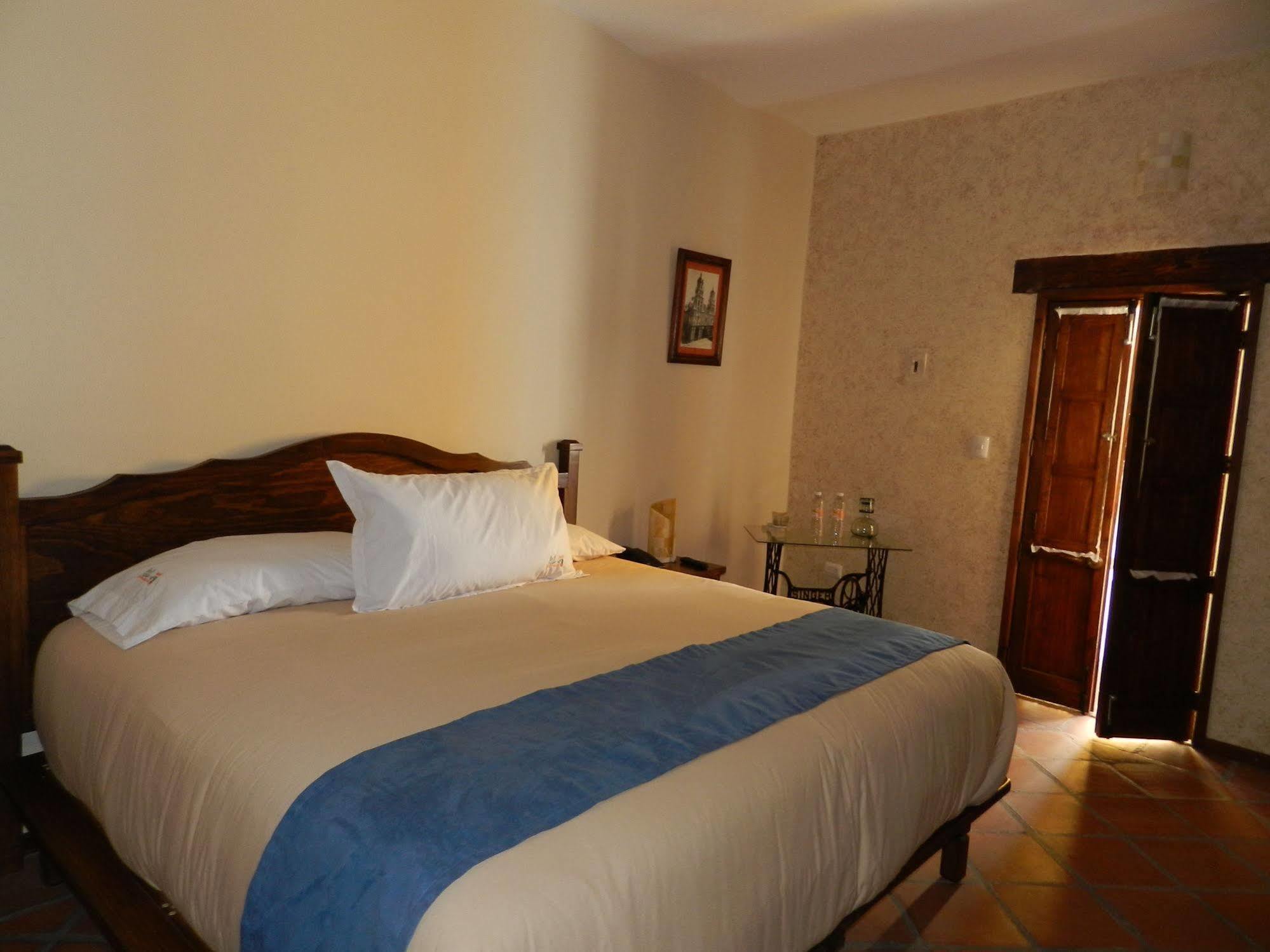 Collection O Al Otro Lado Del Rio, Puebla Hotel Kültér fotó A bedroom at the hotel